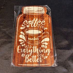 Wooden mason jar shaped sign; coffee makes everything. Includes twine string.
